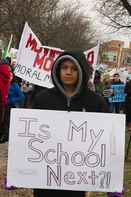 Student holding sign Is My School Next?